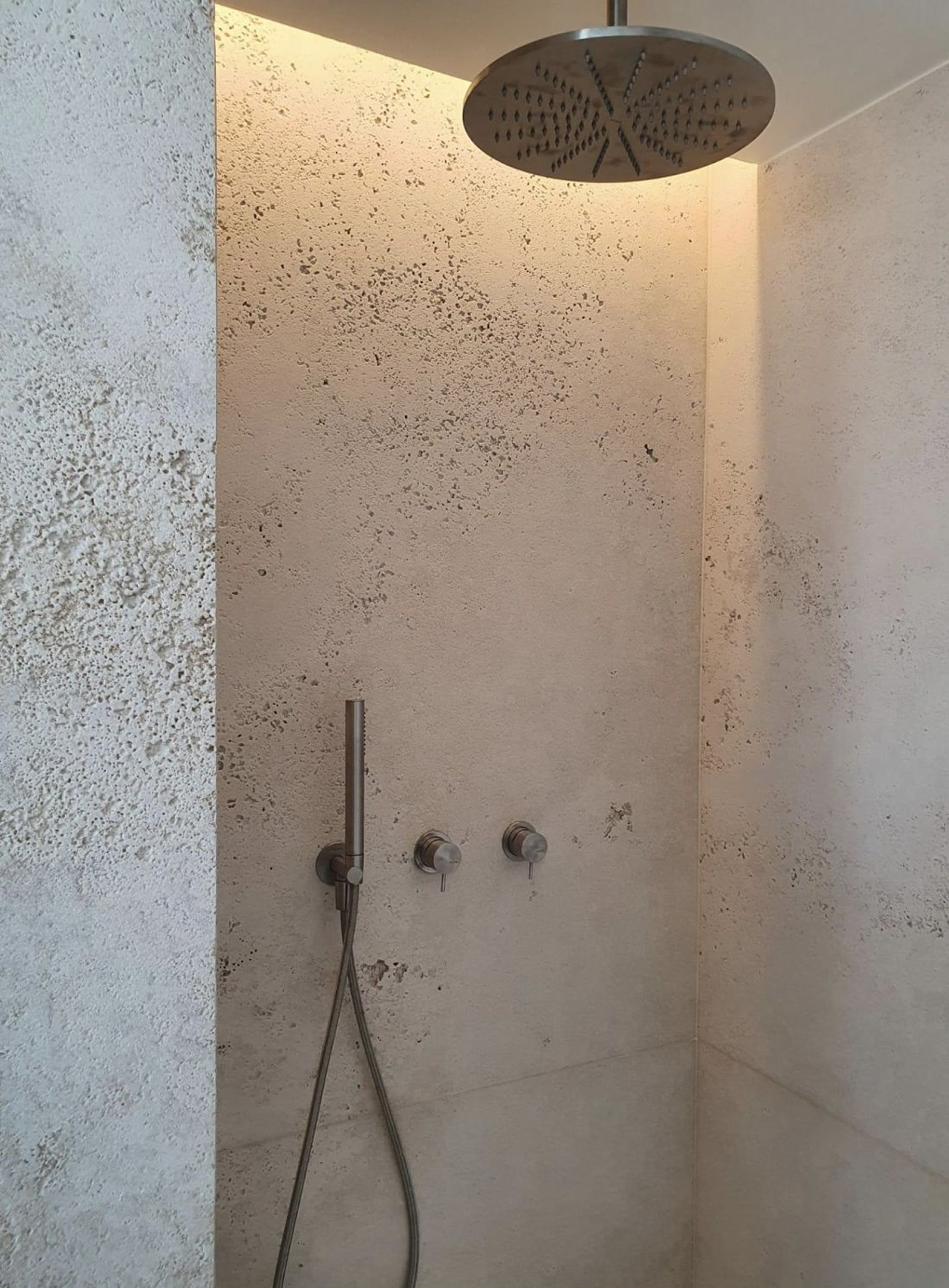 Microcement bathroom application with seamless walls and floor