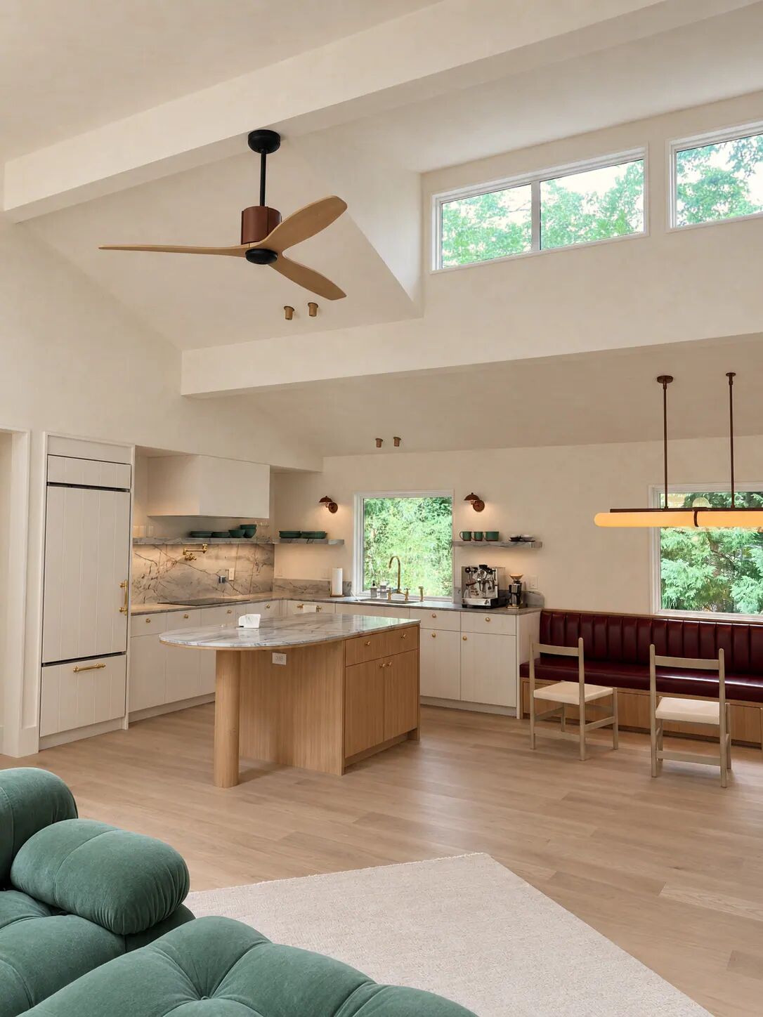 Open-plan kitchen and dining area finished in limewash, Hamptons residence